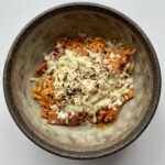 spicy samyang carbonara in a brown bowl.