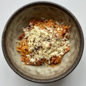 spicy samyang carbonara in a brown bowl.