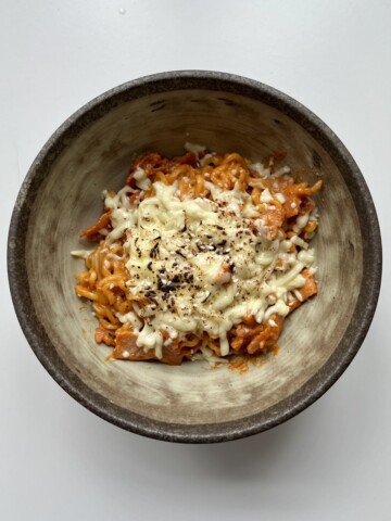 spicy samyang carbonara in a brown bowl.