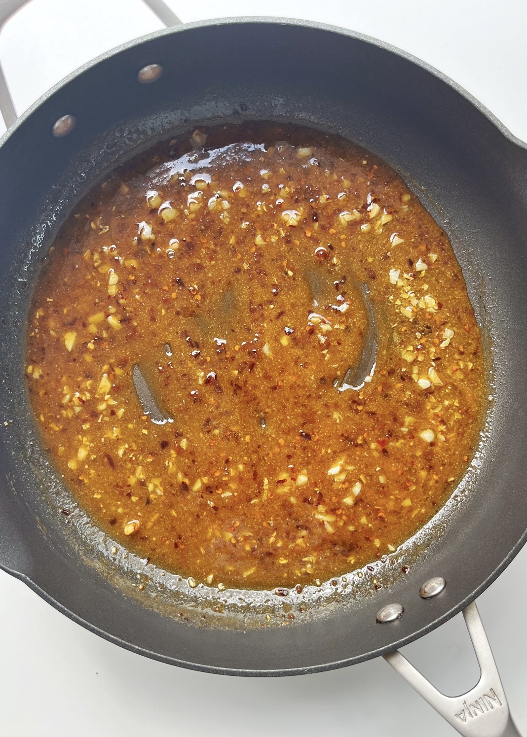 Chilli Oil Tahini Sauce in frying pan