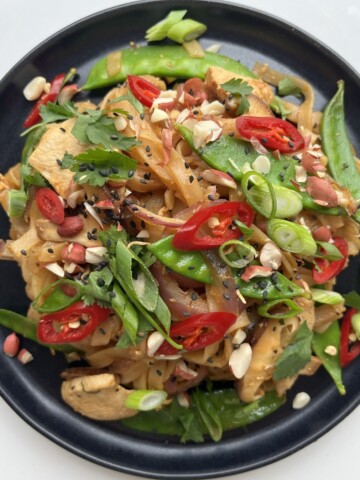 Wagamama pad Thai recipe on black plate.