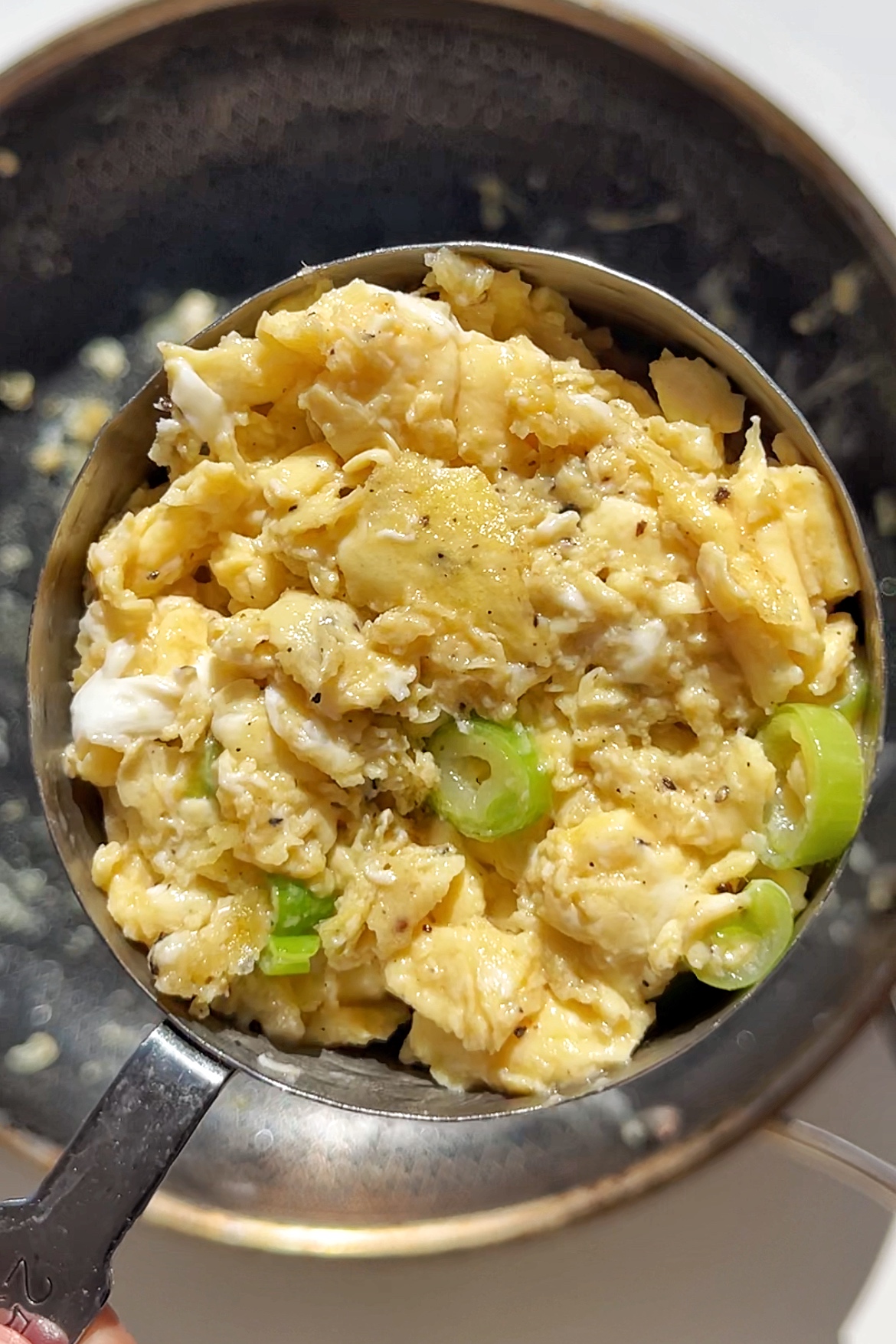 Scrambled eggs in a cup.