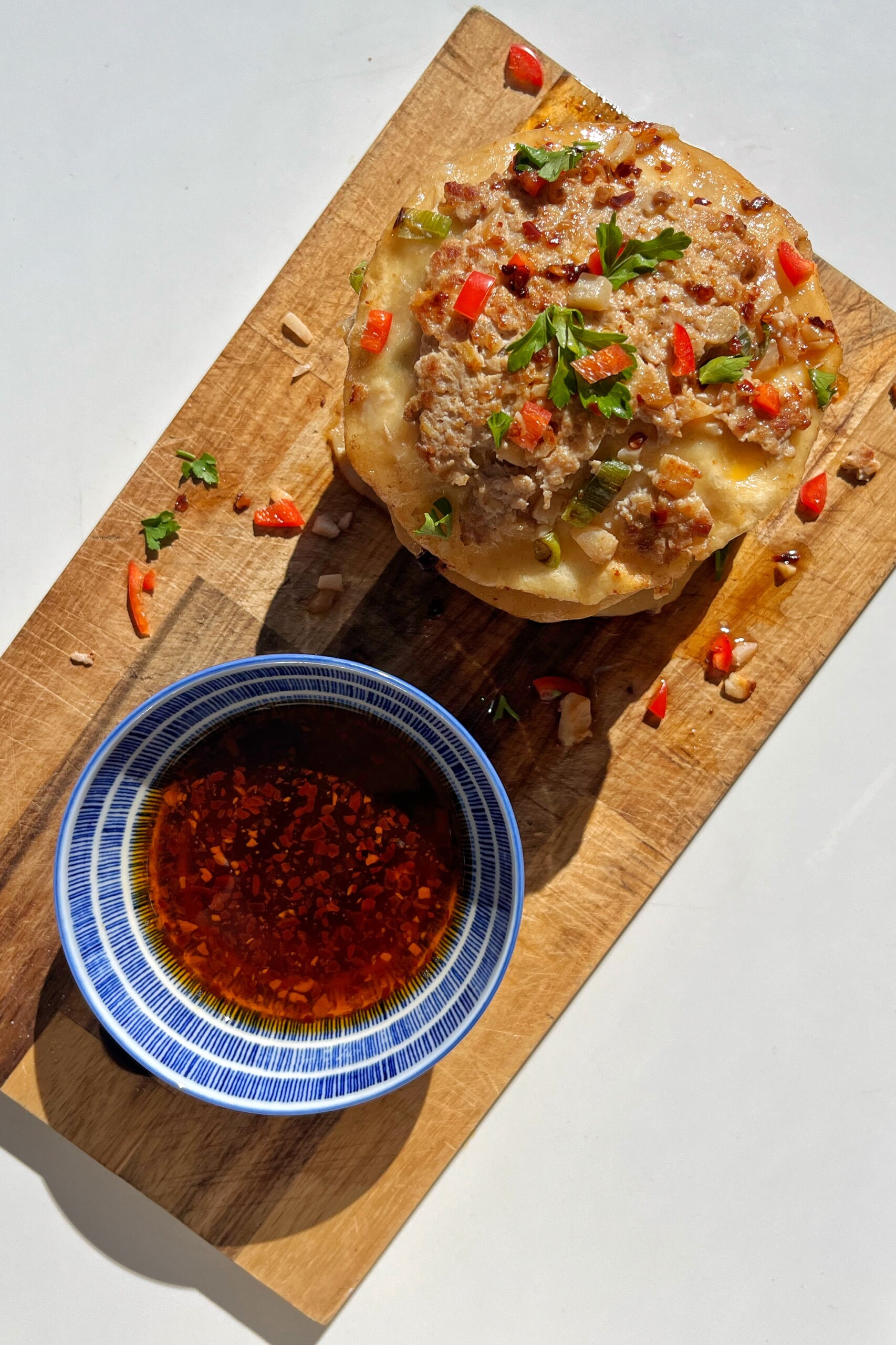 Smash Gyoza with dipping sauce.