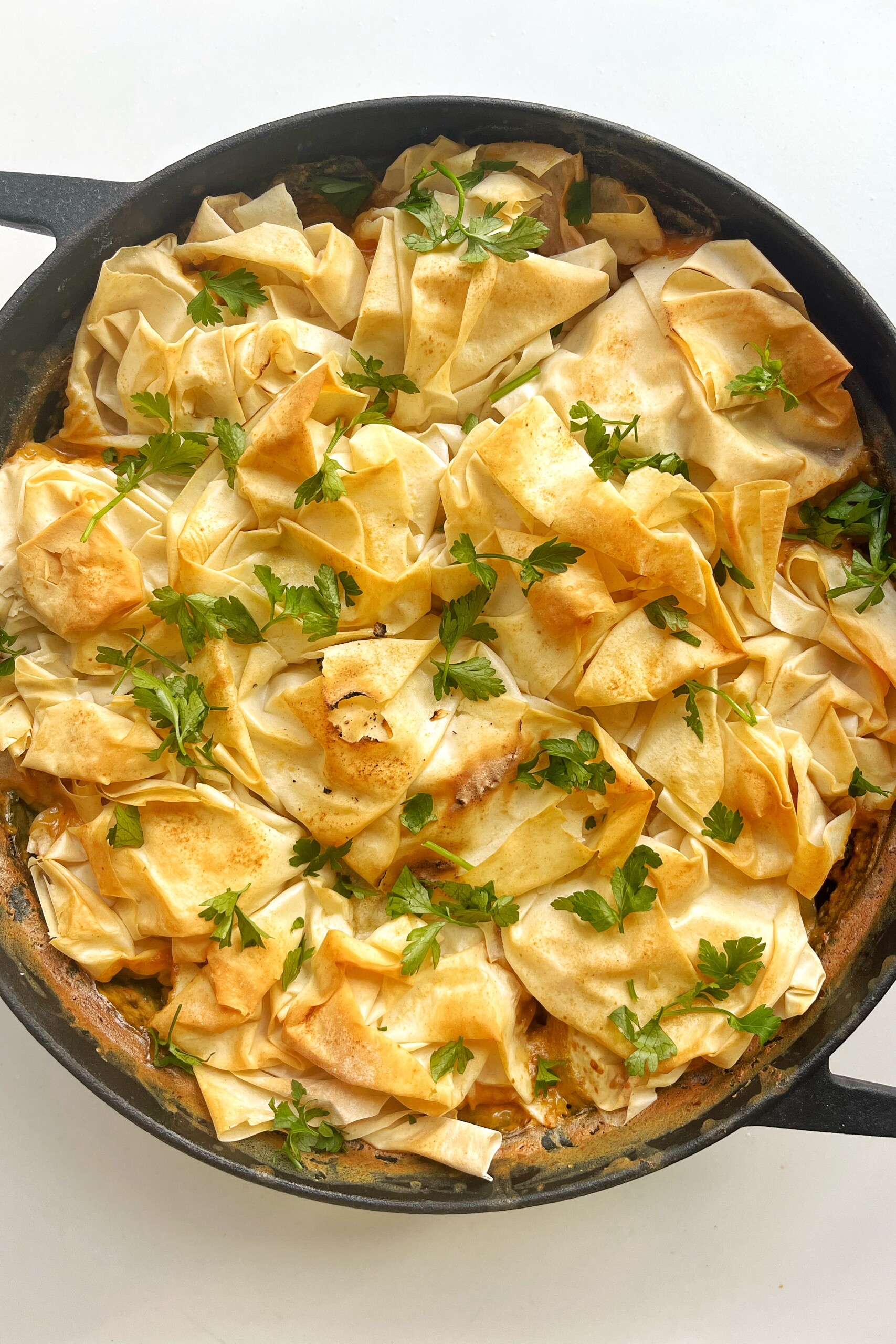 Marry me chicken pie in black skillet.