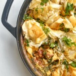 Marry me chicken pie in black oven-proof skillet.
