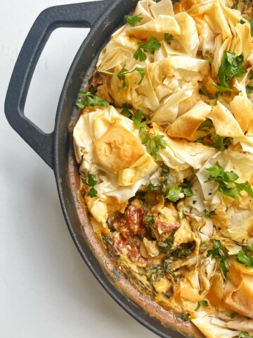 Marry me chicken pie in black oven-proof skillet.