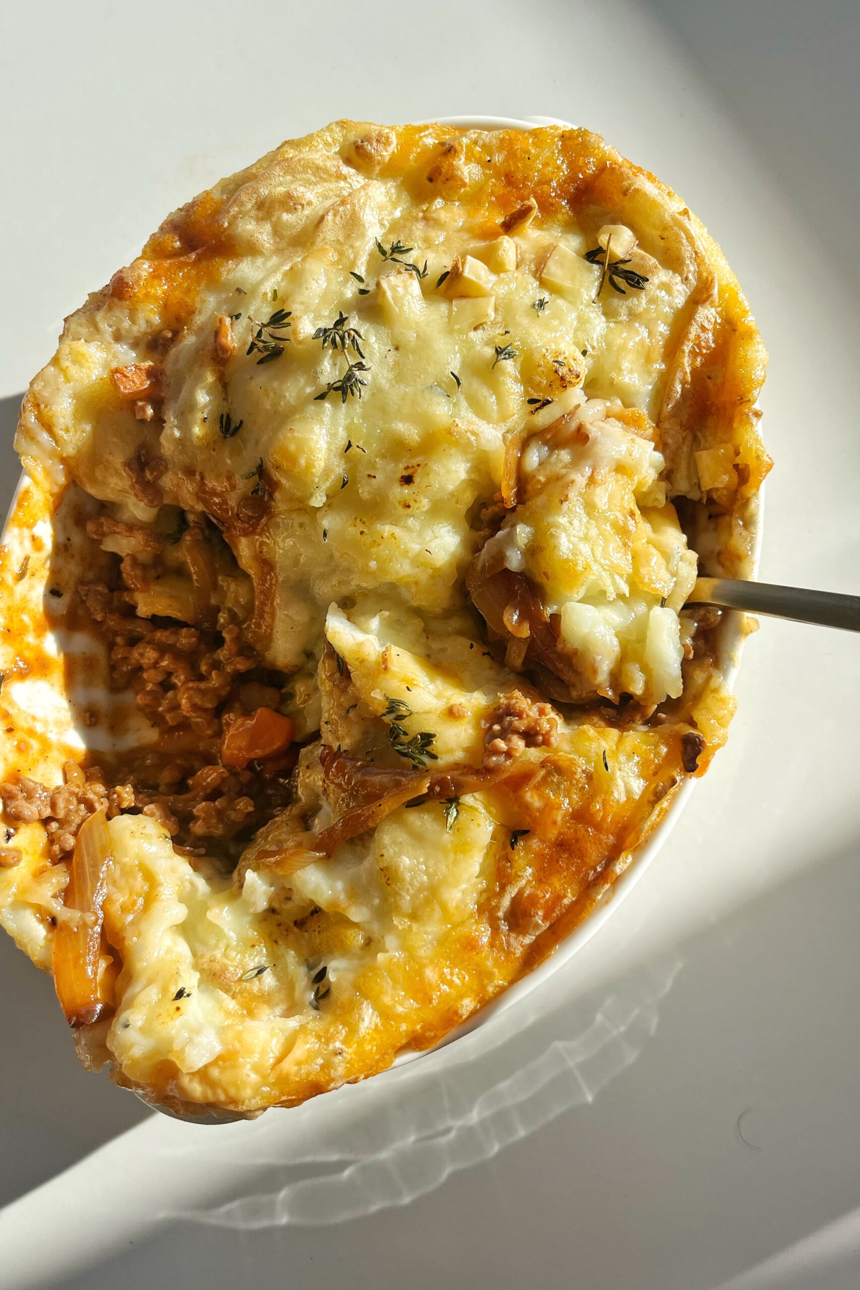 Spoon in French onion cottage pie.