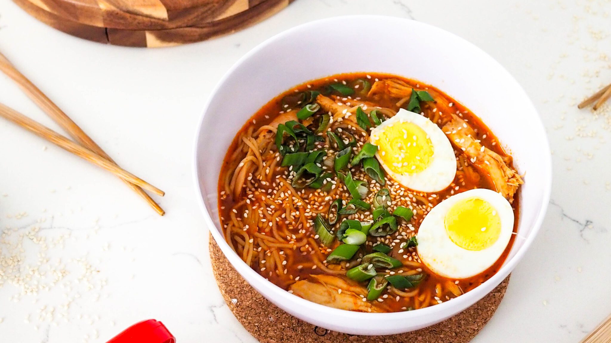 Gochujang chicken ramen topped with egg.