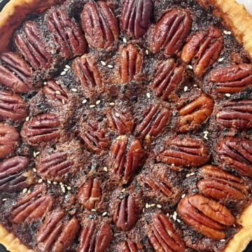 Miso Pecan Pie on a black plate.