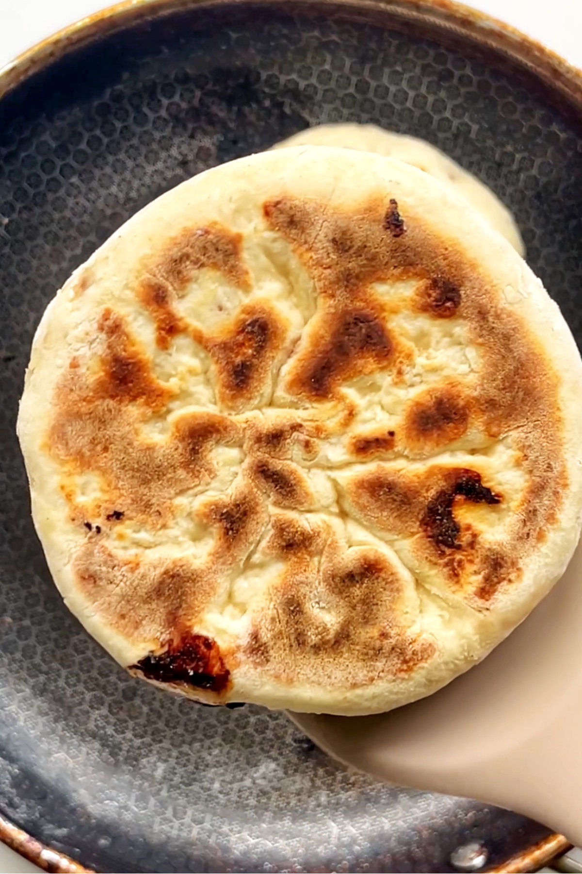 Pan frying the festive turkey flatbreads until golden.