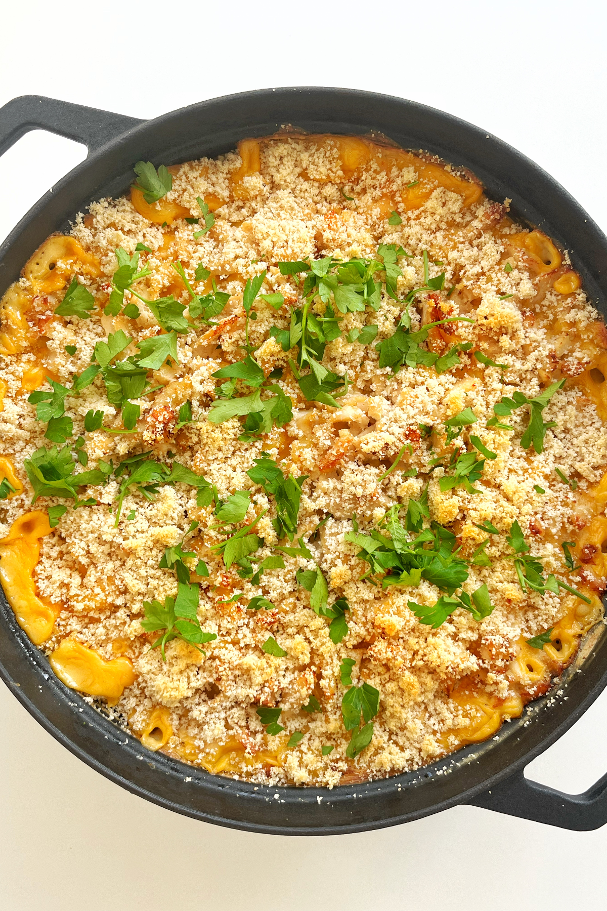 Black pan with turkey Mac and cheese inside.