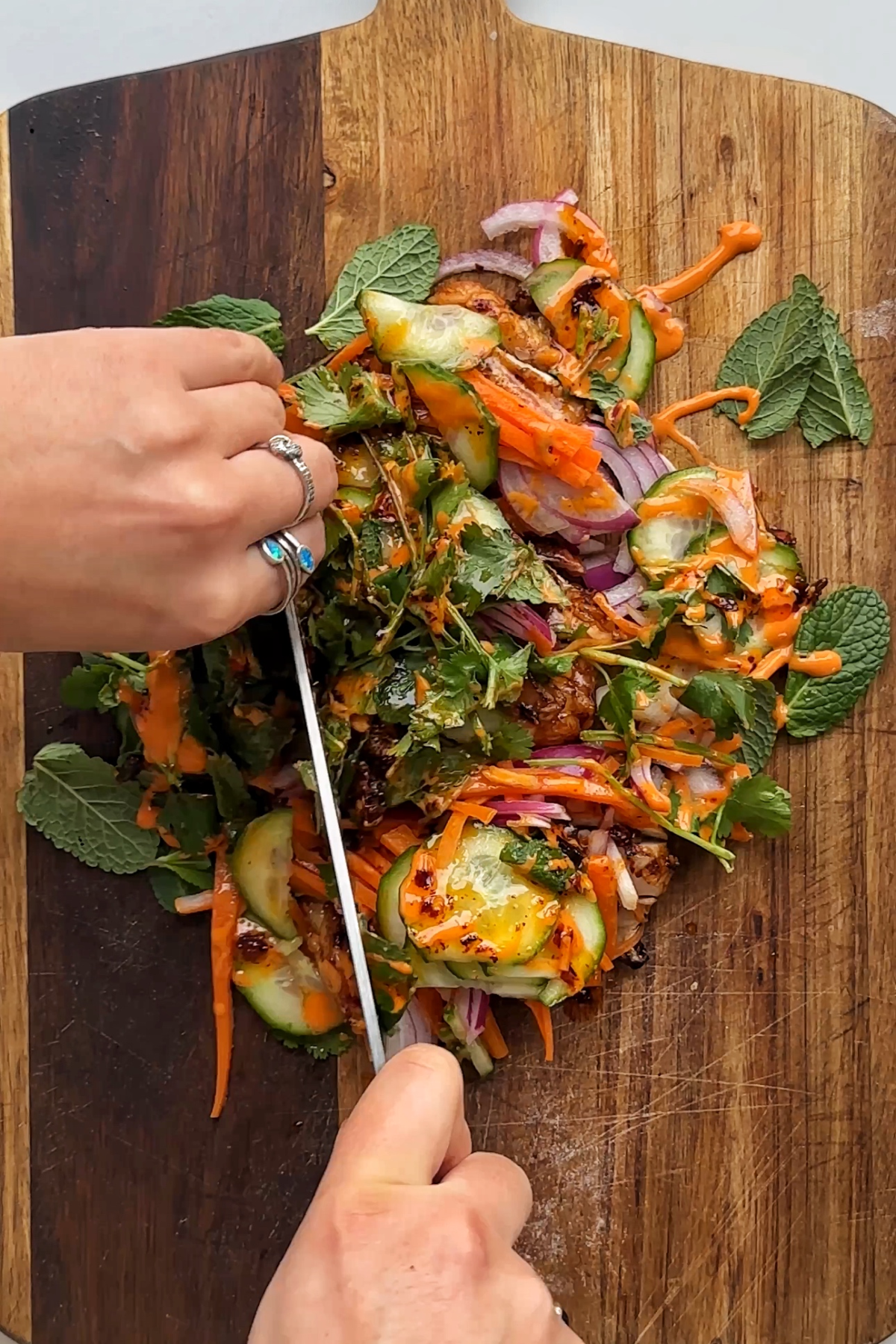 Chopping ingredients on a chopping board.