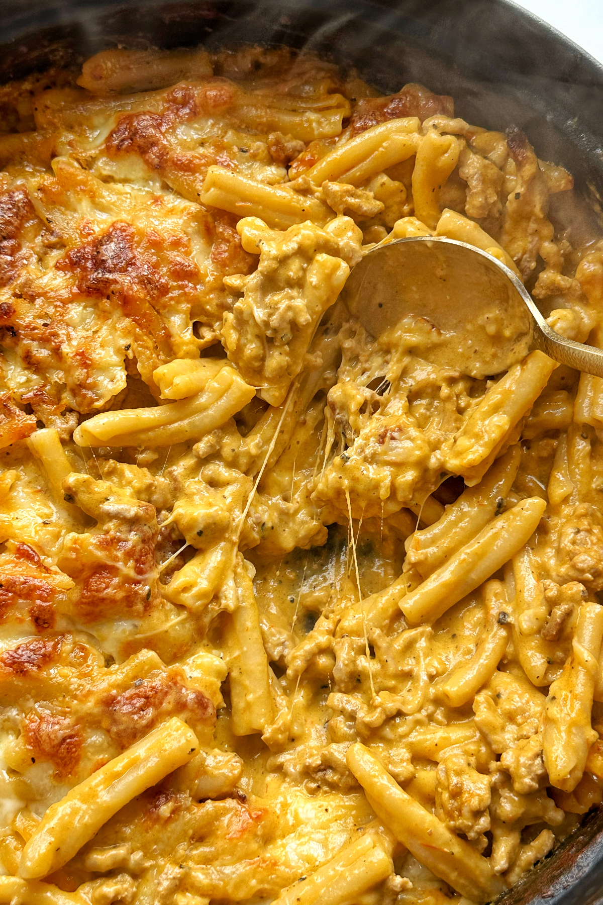 Cheese pull in a pasta dish.