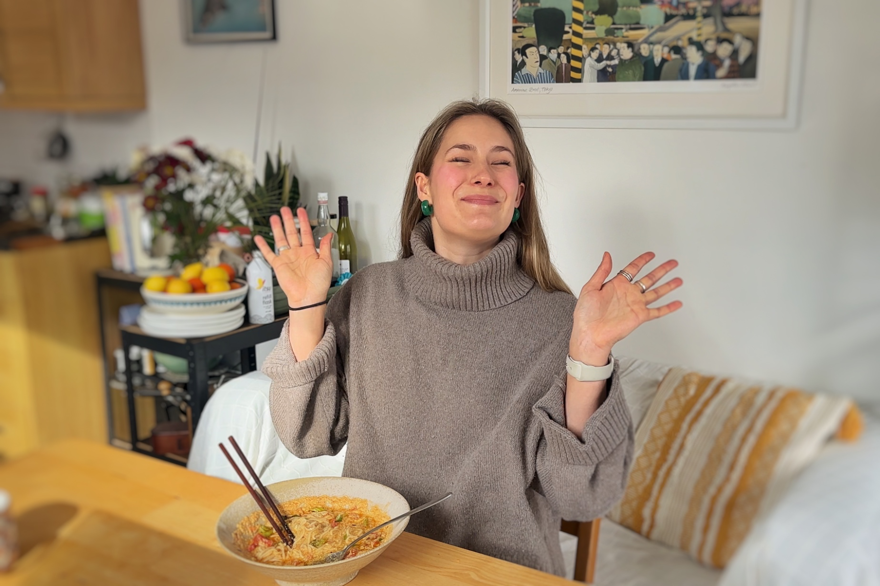 Emily Roz eating a bowl of noodles