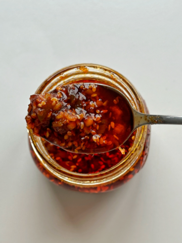 Chilli oil being picked up by spoon.