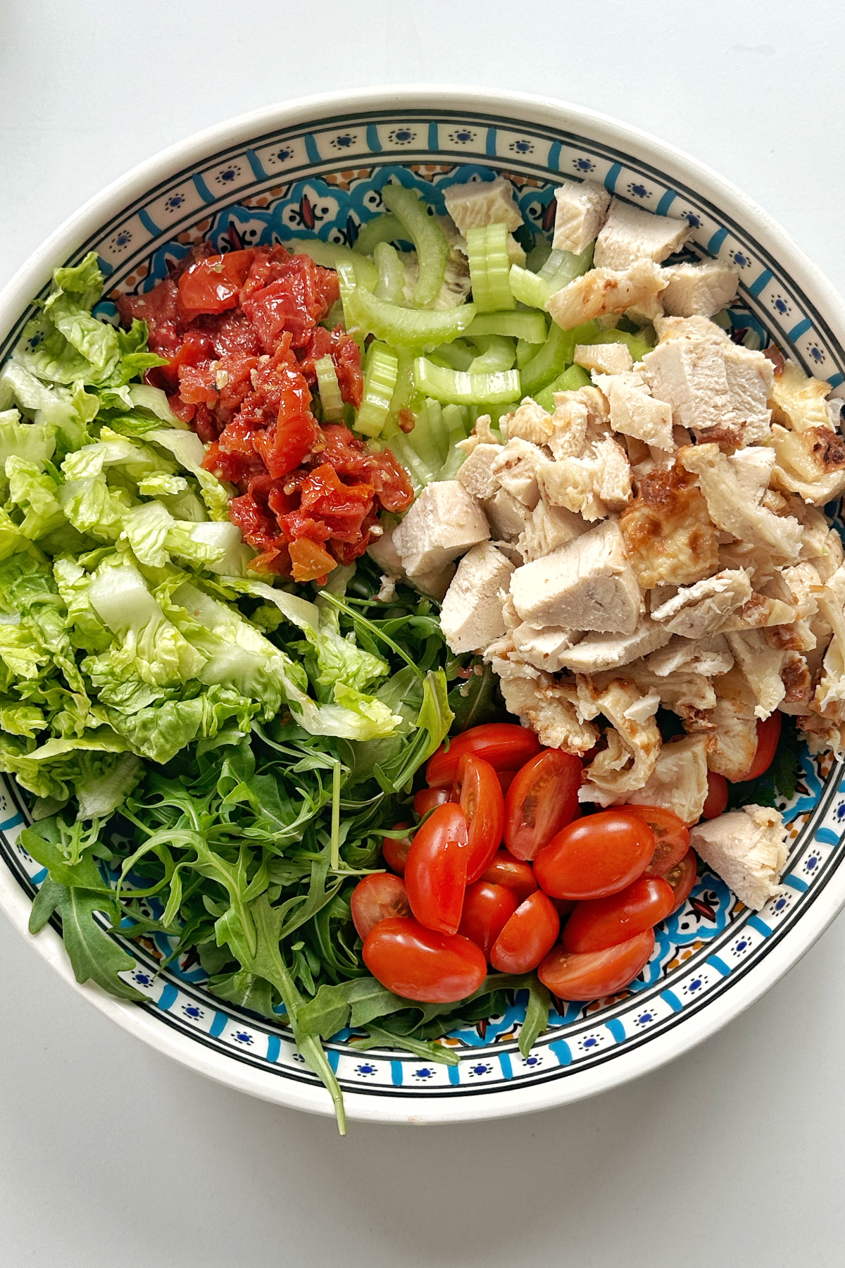 Chopped salad ingredients in a large bowl.