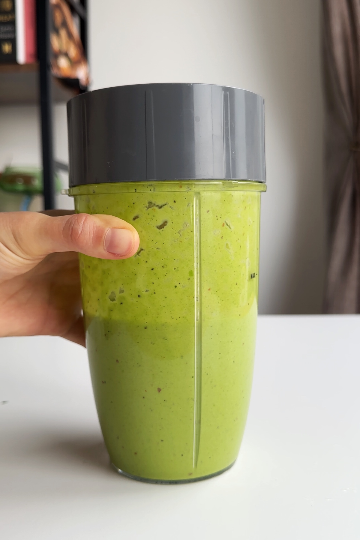 Green pea sauce in a blender.