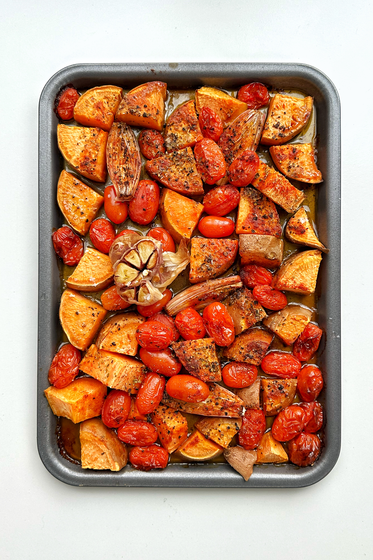 Sheet pan full of roasted vegetables.