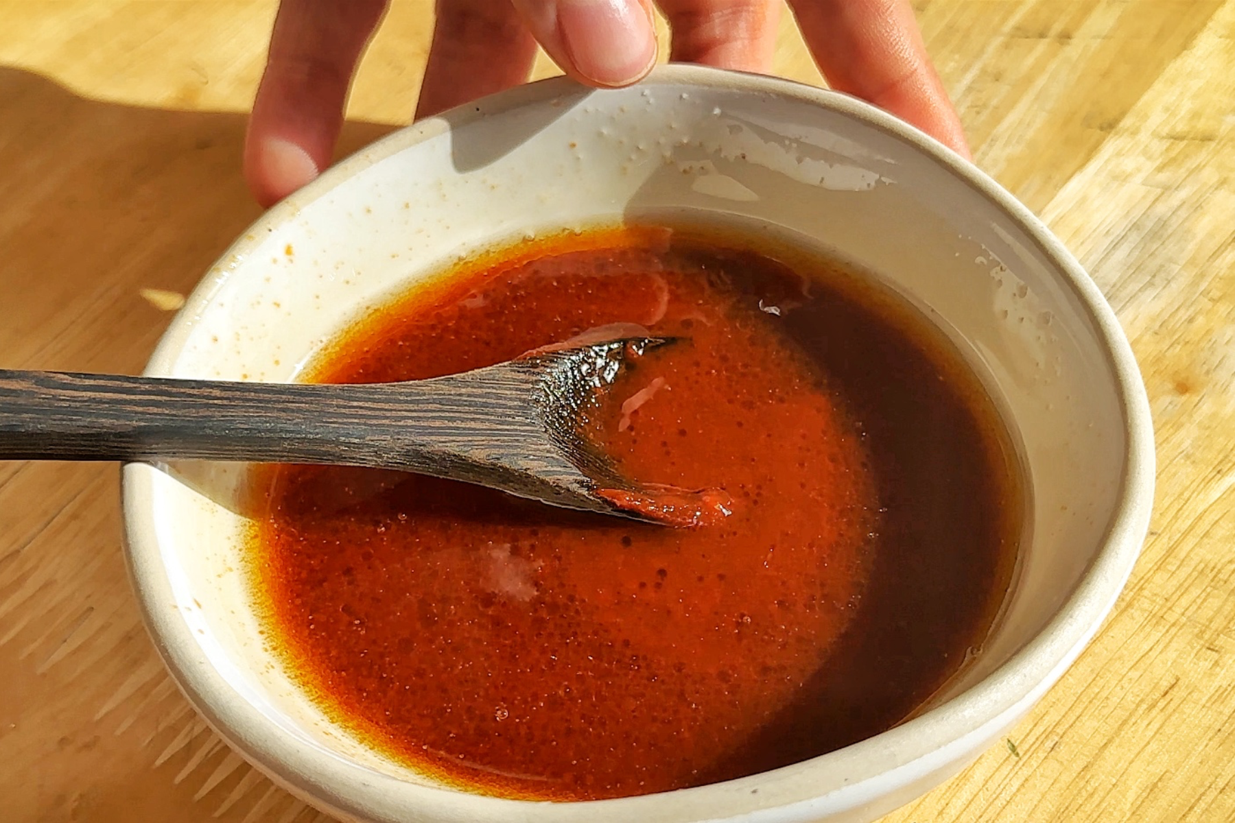Making a gochujang sauce in a small bowl.