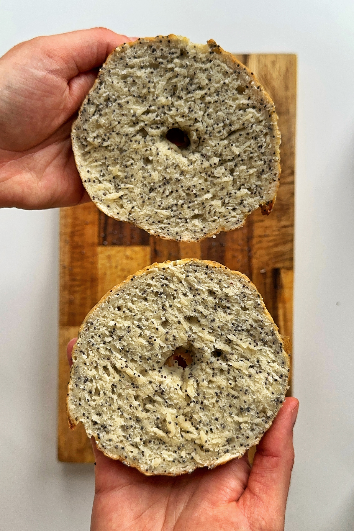 Opening up a bagel in half.