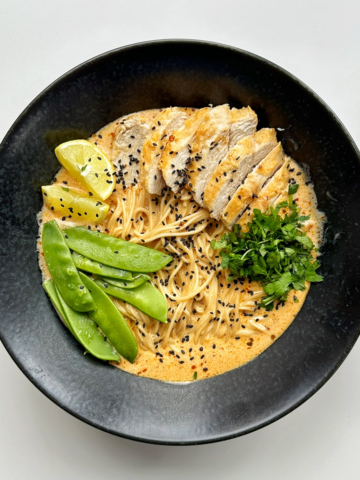 Lemon Chicken Ramen in a black ramen bowl.