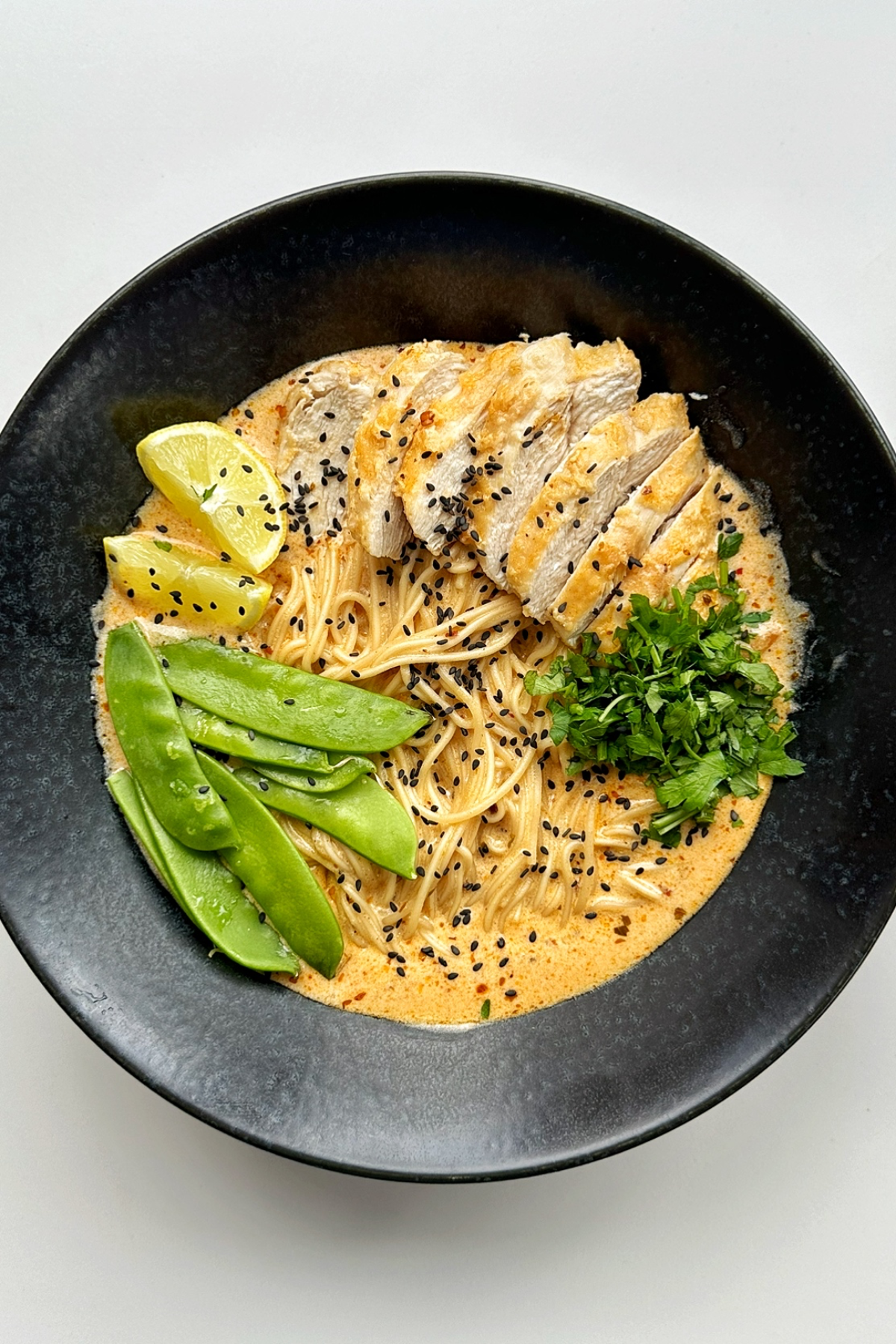 Lemon Chicken Ramen in a black ramen bowl.