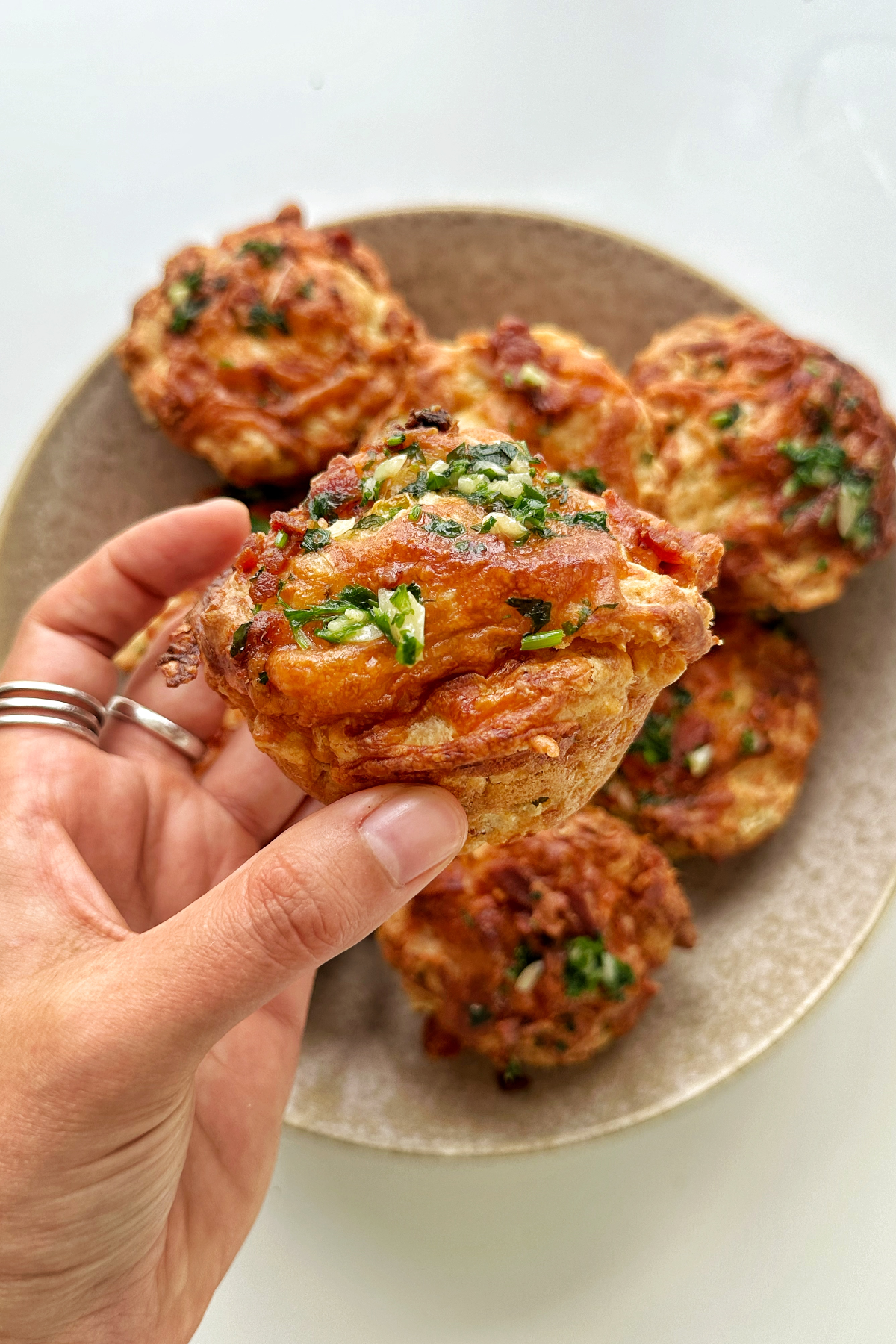 Cheese and bacon muffins in a bowl. 