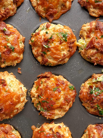 Cheese and bacon muffins in a tray.