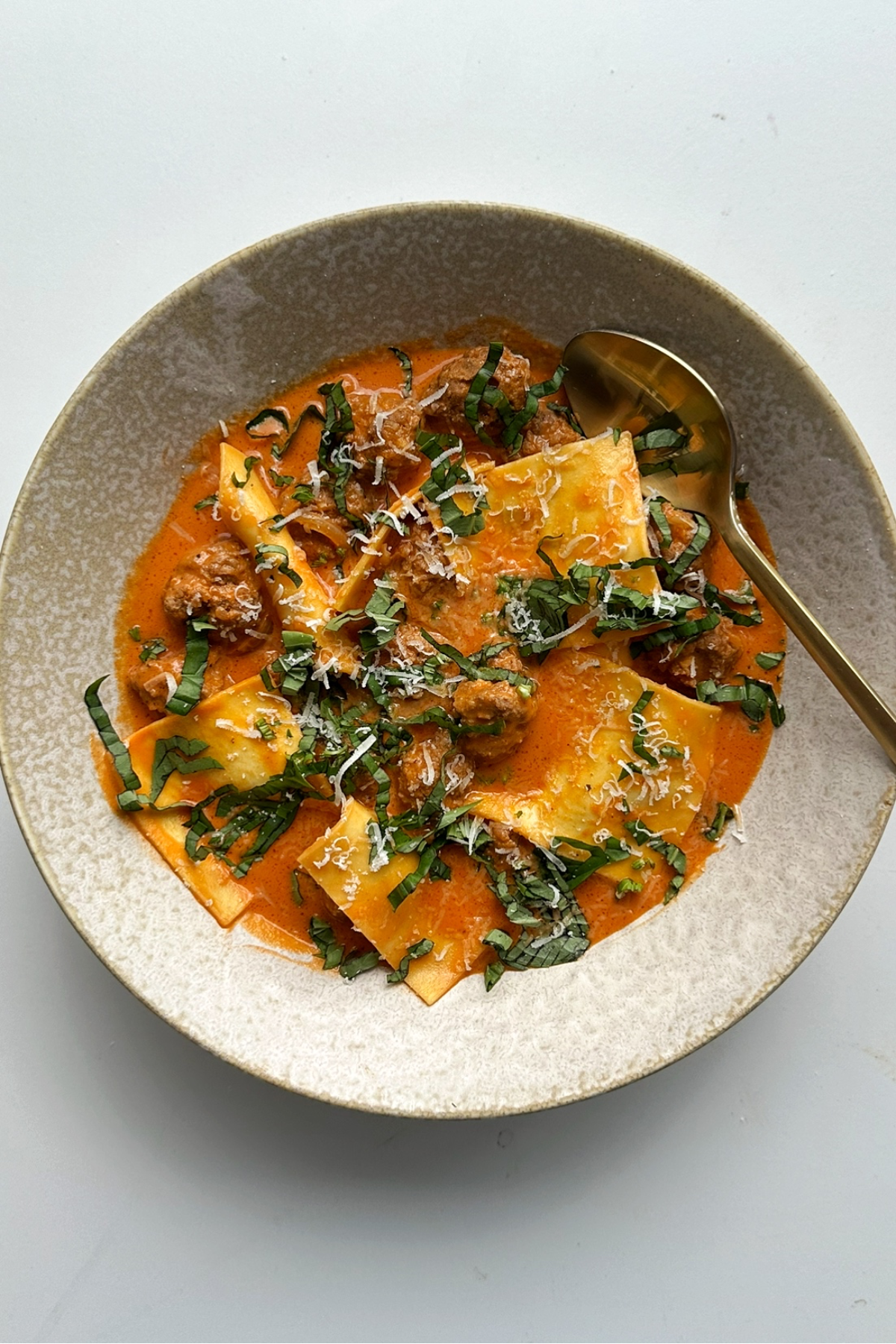 Bowl of deconstructed ravioli soup.