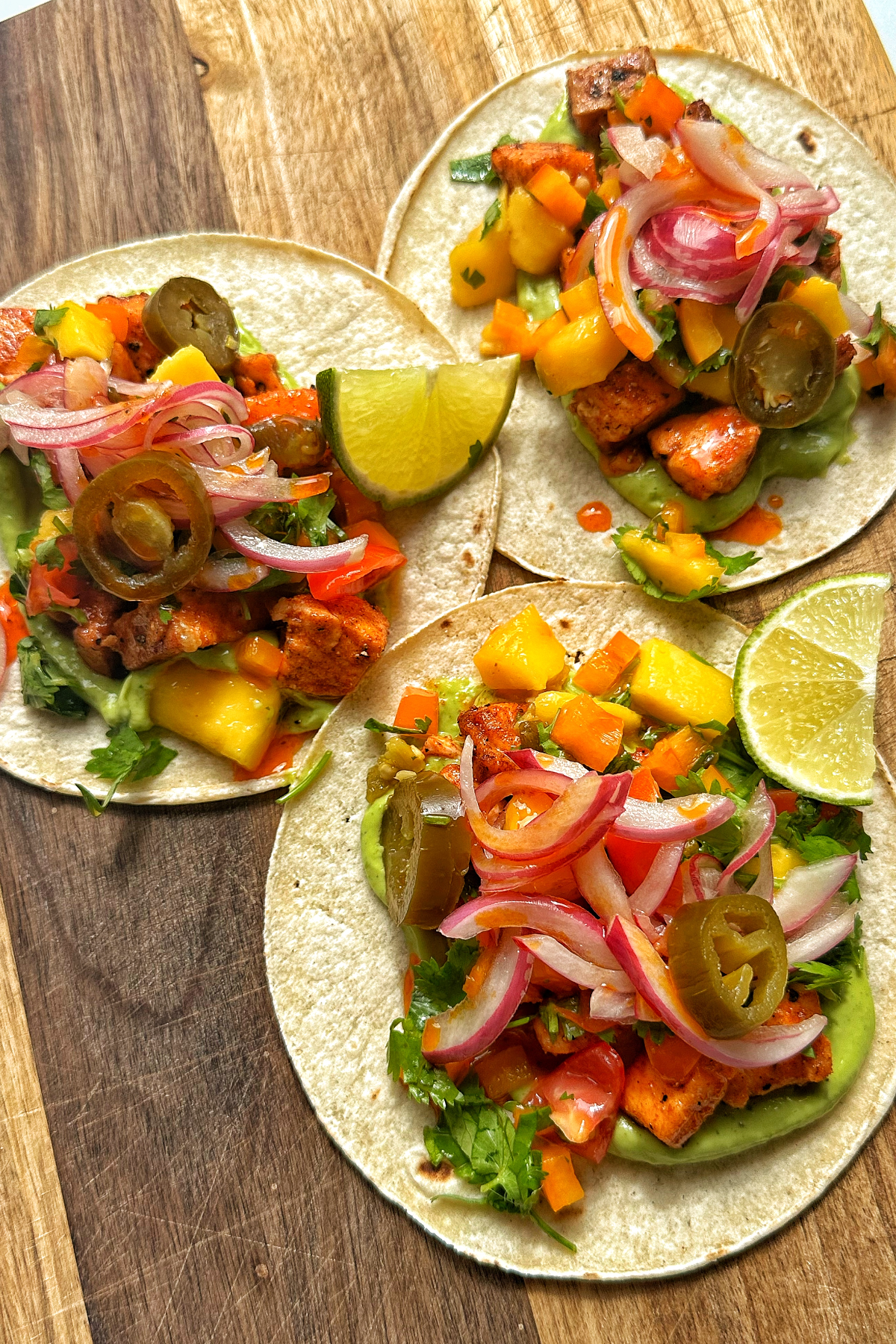 Salmon fish tacos with mango salsa and an avocado cilantro cream. 