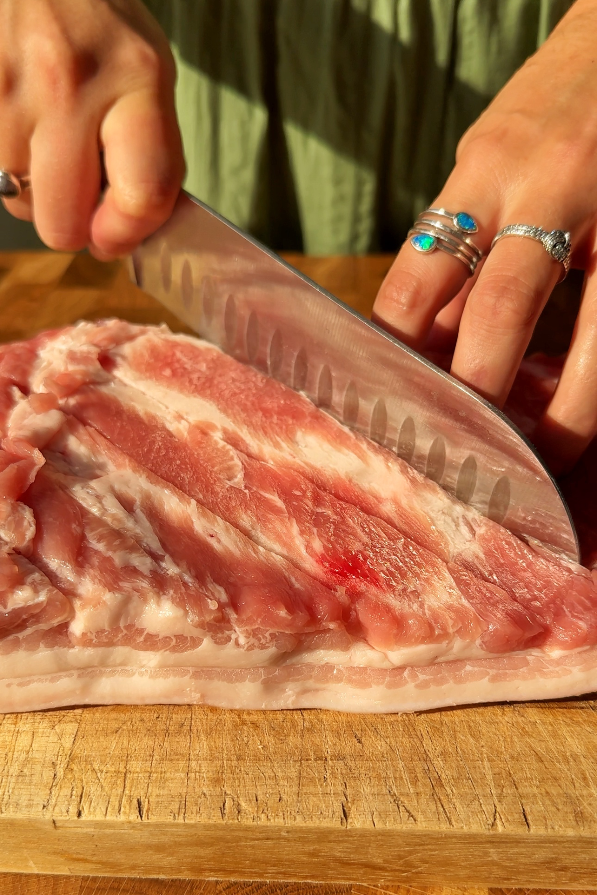 Scoring the meat of pork belly.