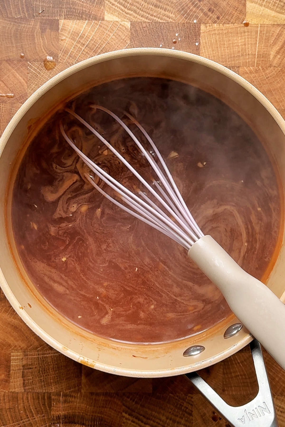 Making sweet and sour sauce.
