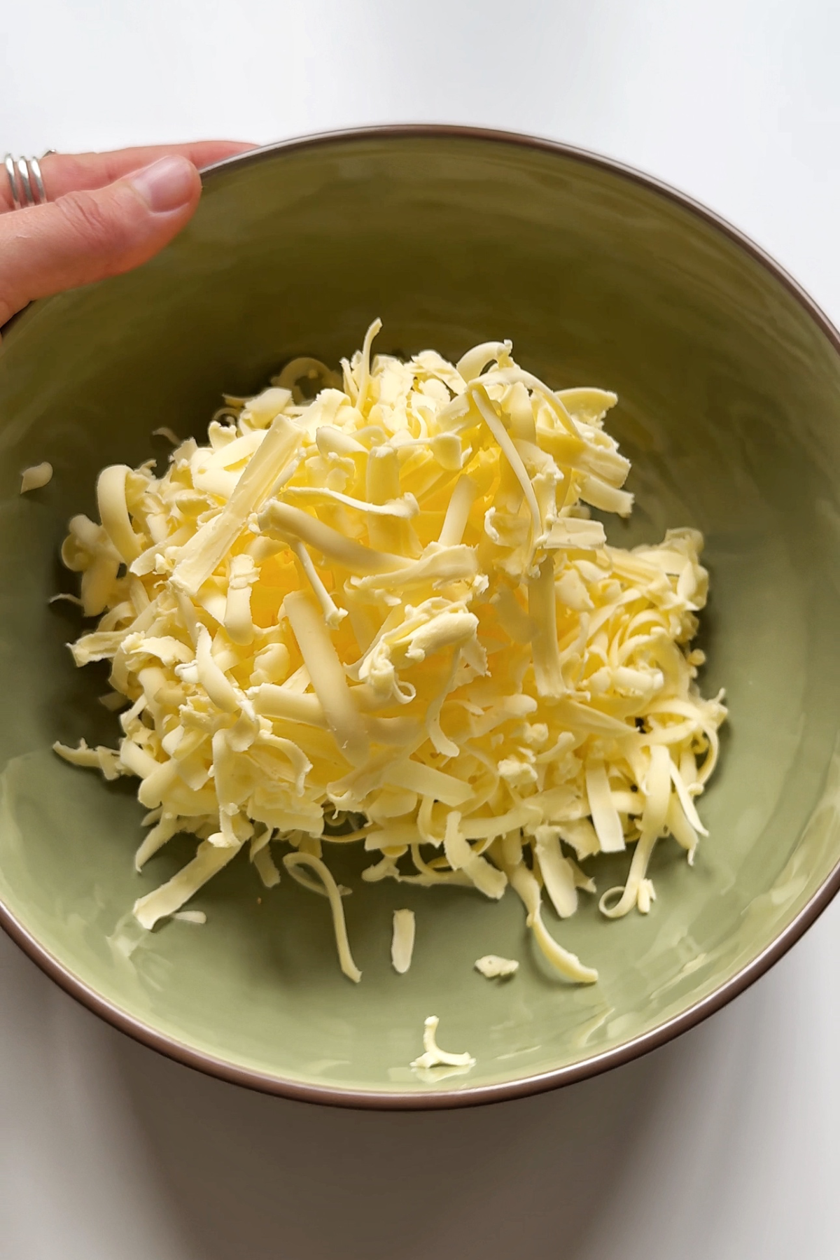 Grated butter into a bowl.