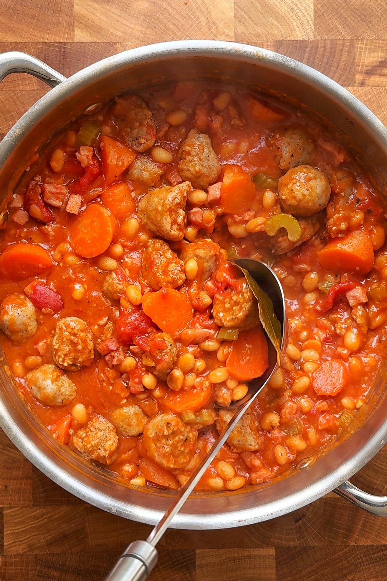 Final shot of sausage stew with a ladle