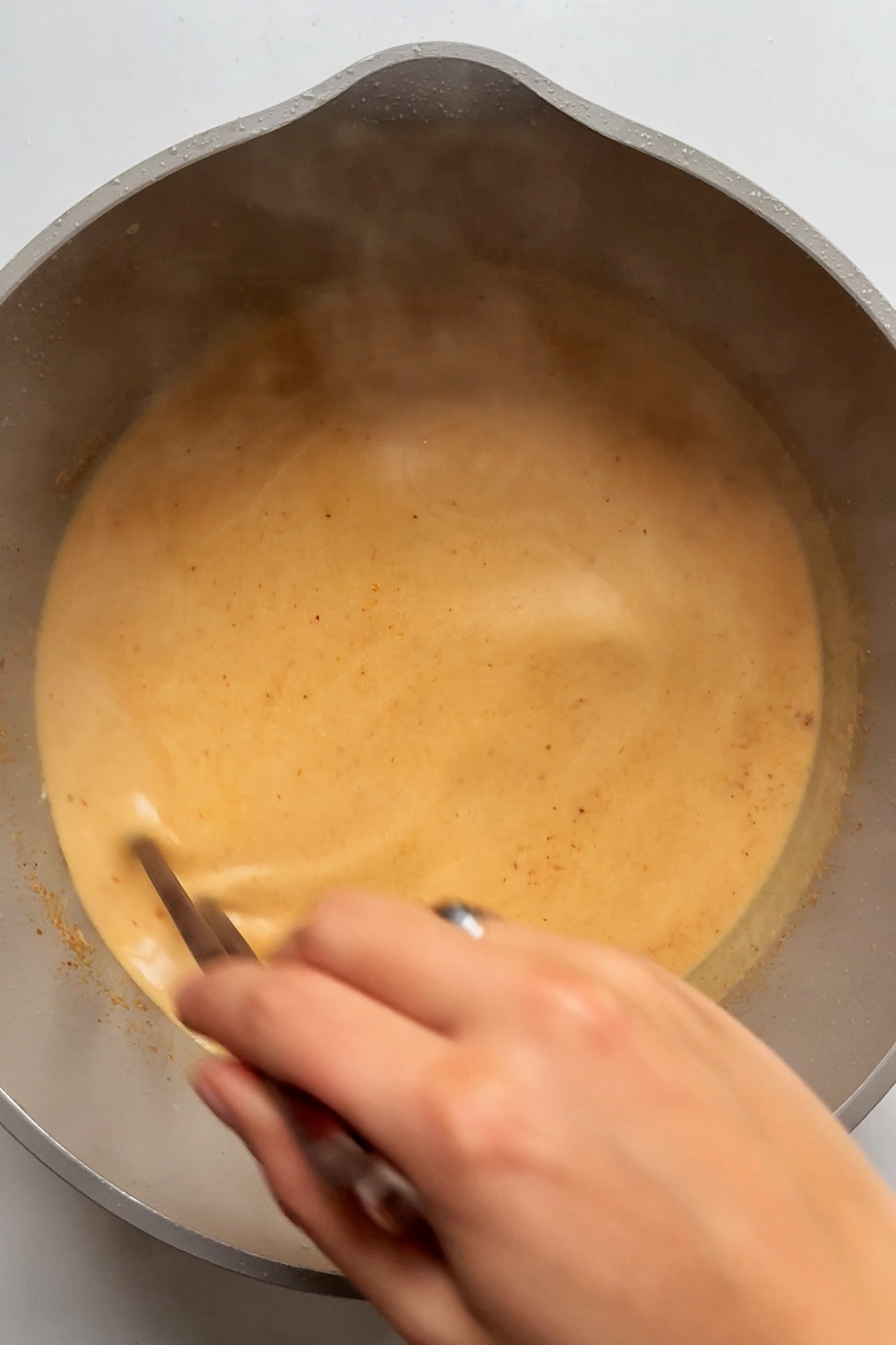 Making the Thai peanut butter sauce.