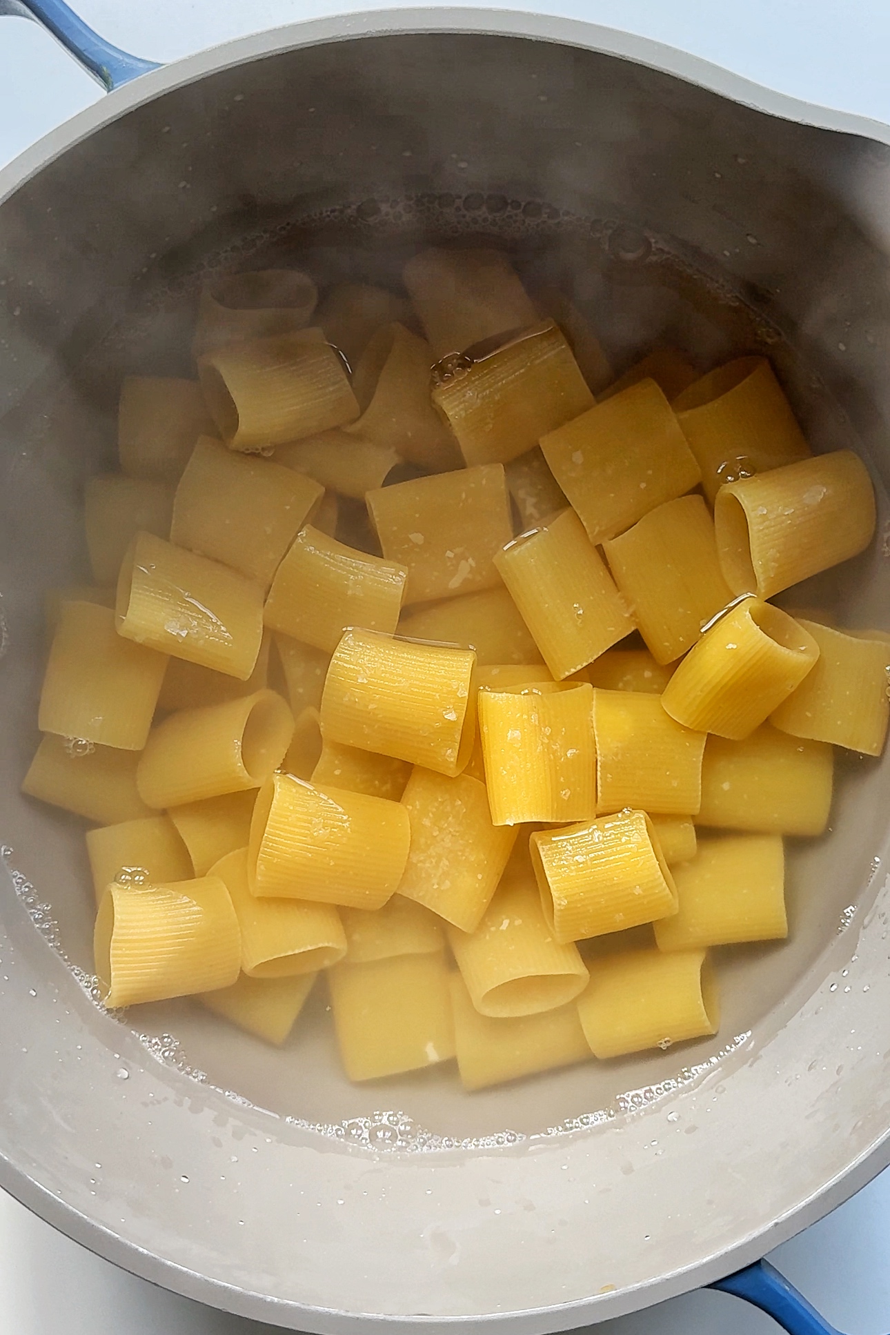 Cooking pasta in a pan.