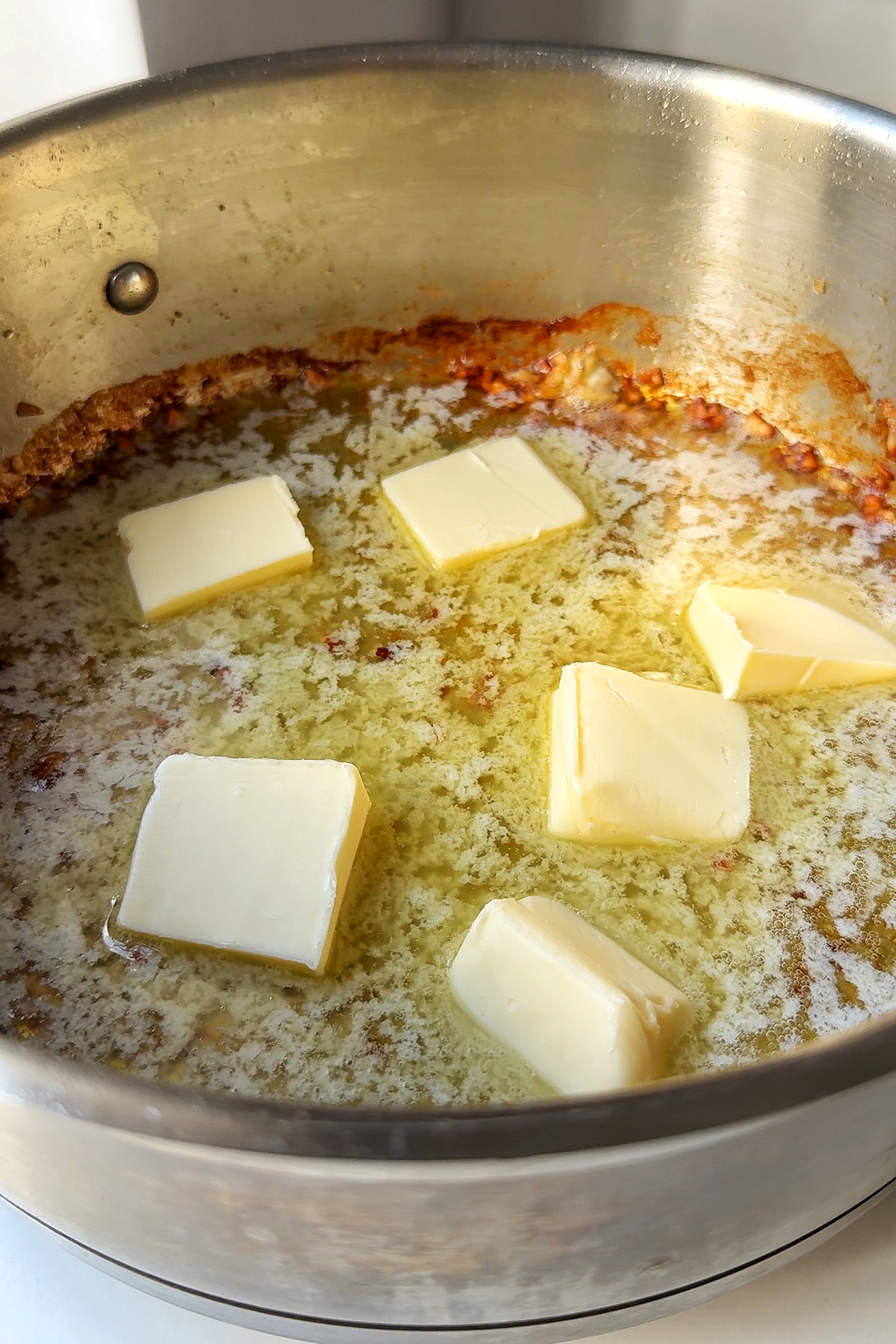 Making the alfredo sauce.