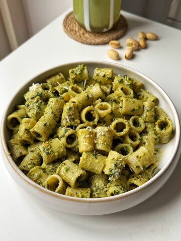 Pistachio pesto in a white bowl.