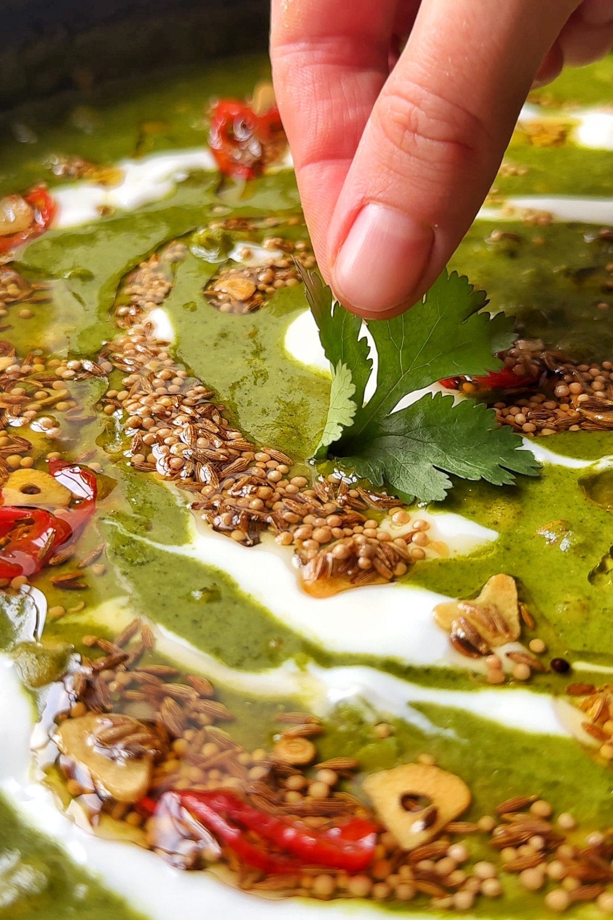 Dishing up the spinach dal.