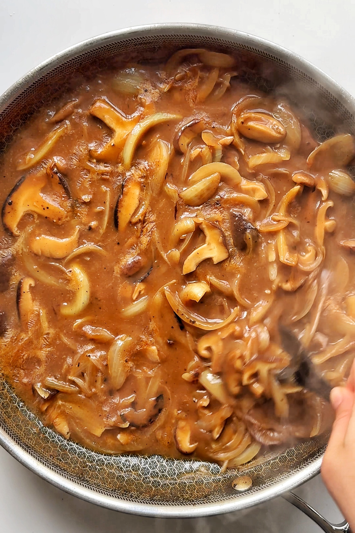 Making the loco moco mushrooms and onion gravy.