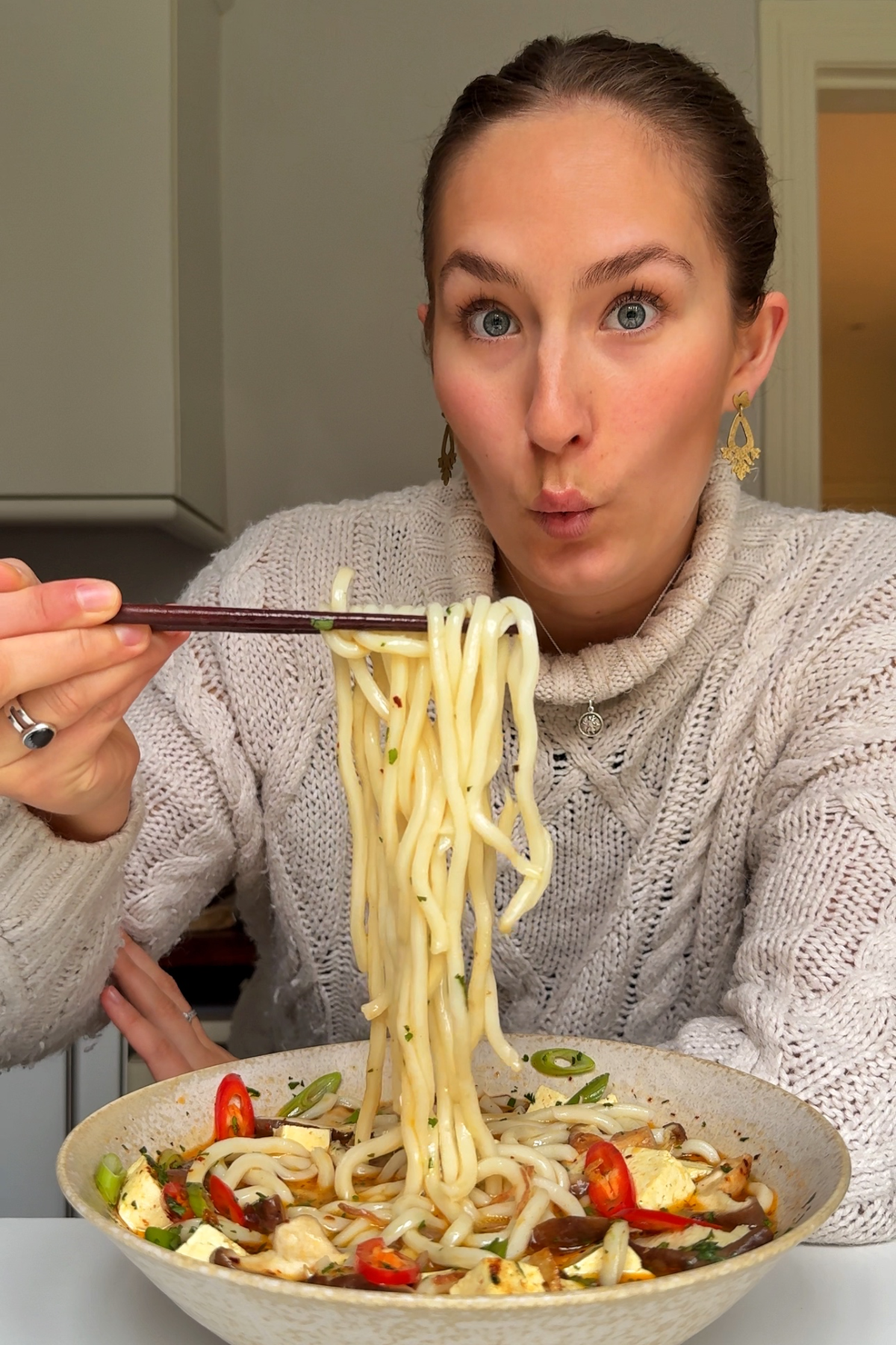 Emily Roz eating miso soup with mushrooms.