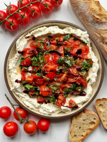 Bruschetta dip with tomatoes and baguette.