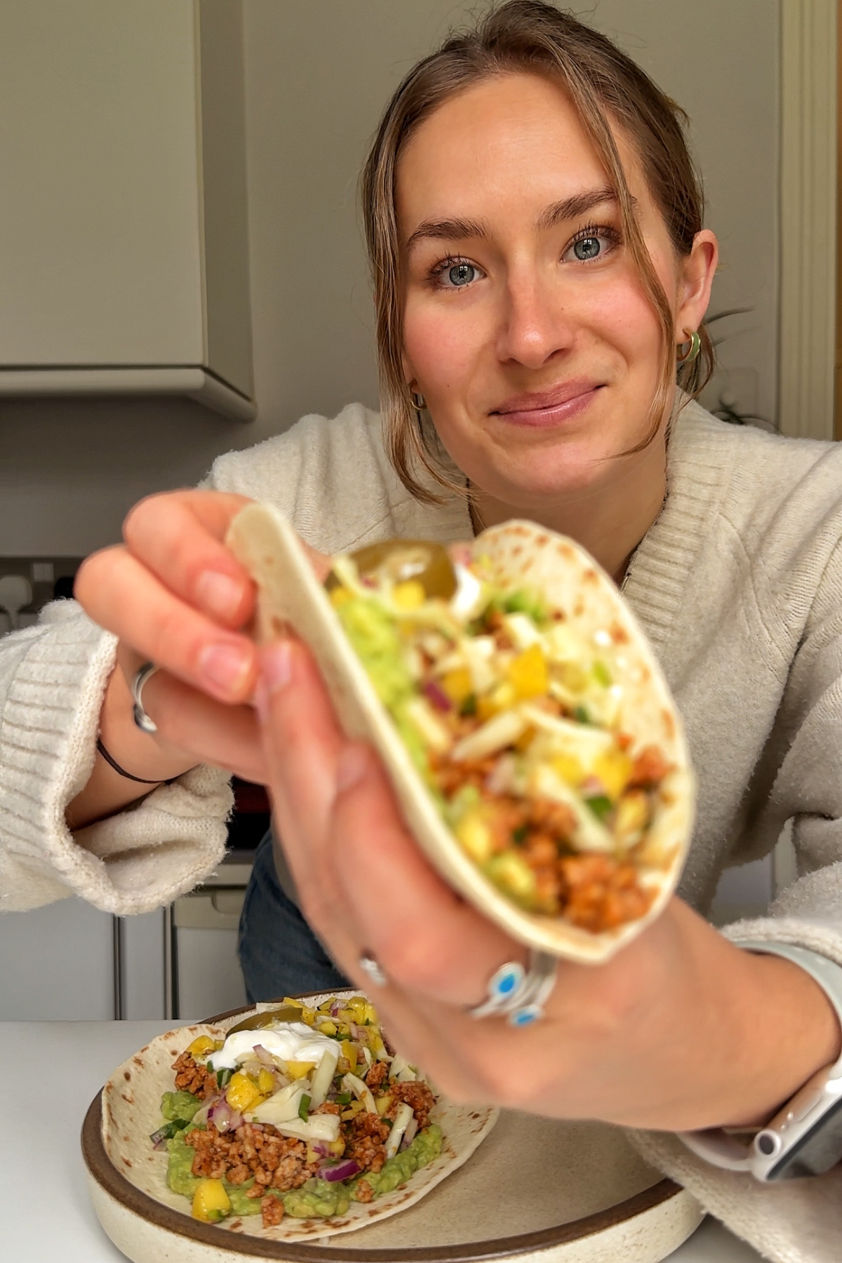 Emily Roz eating ground pork taco.