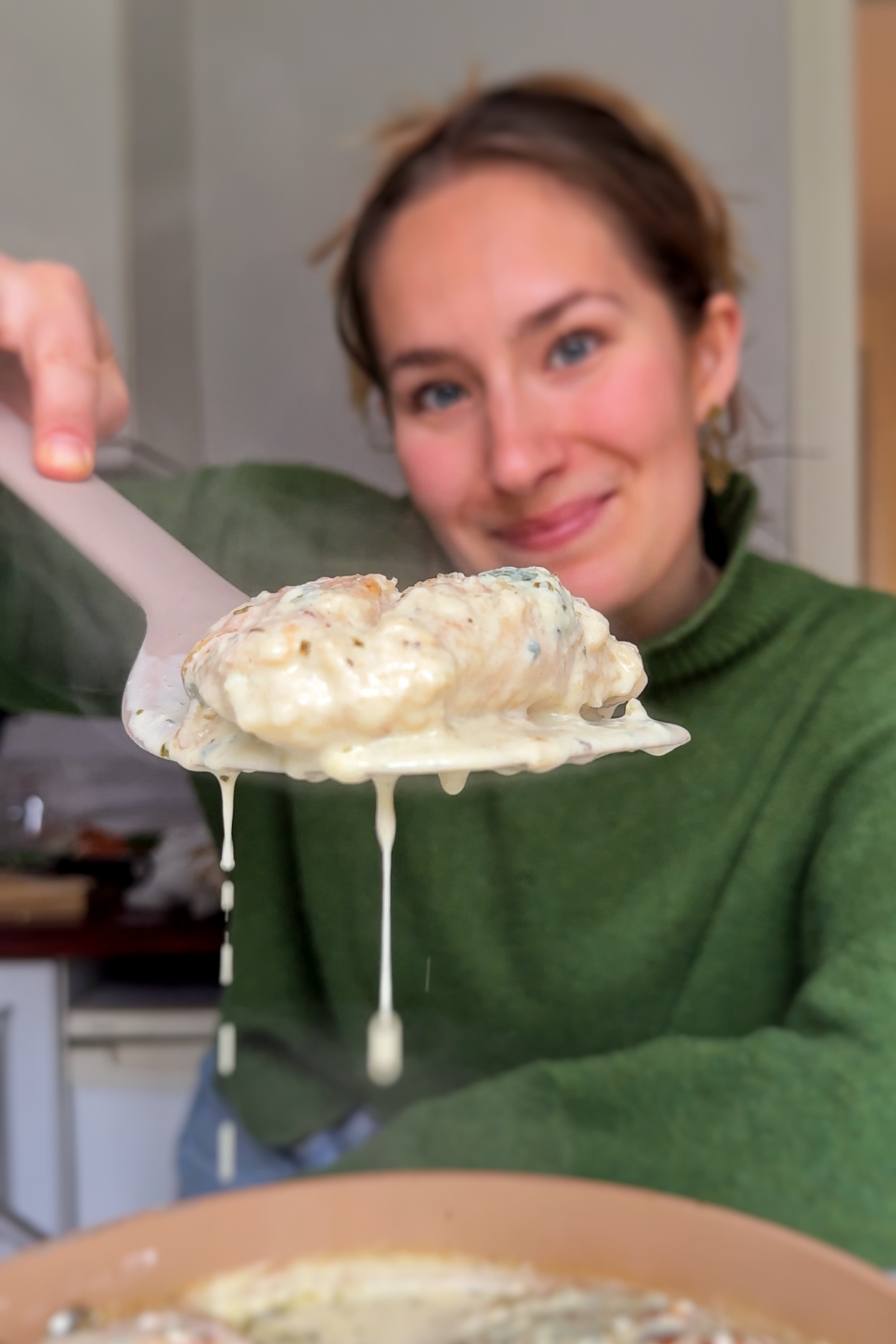 Emily Roz holding up chicken gorgonzola.