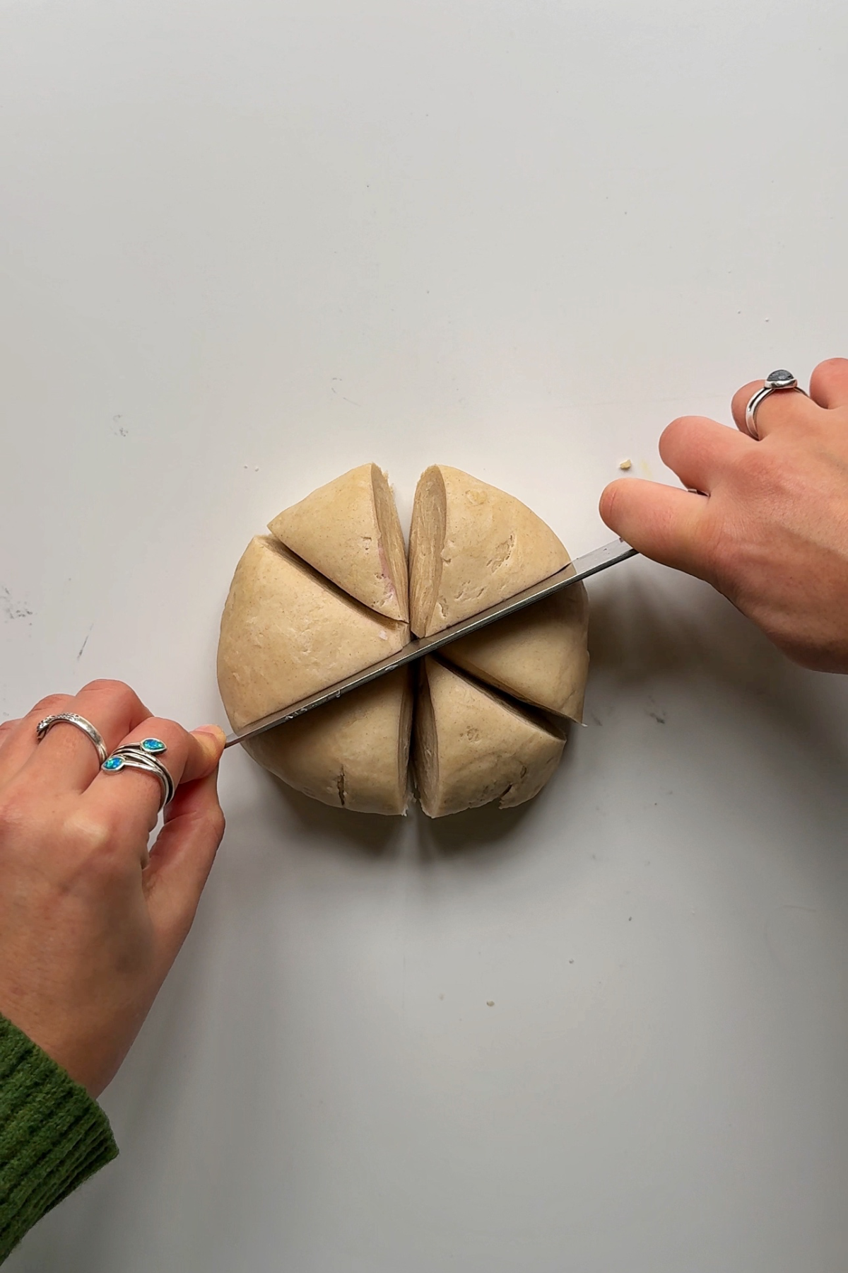 Slicing dough into 6 pieces.