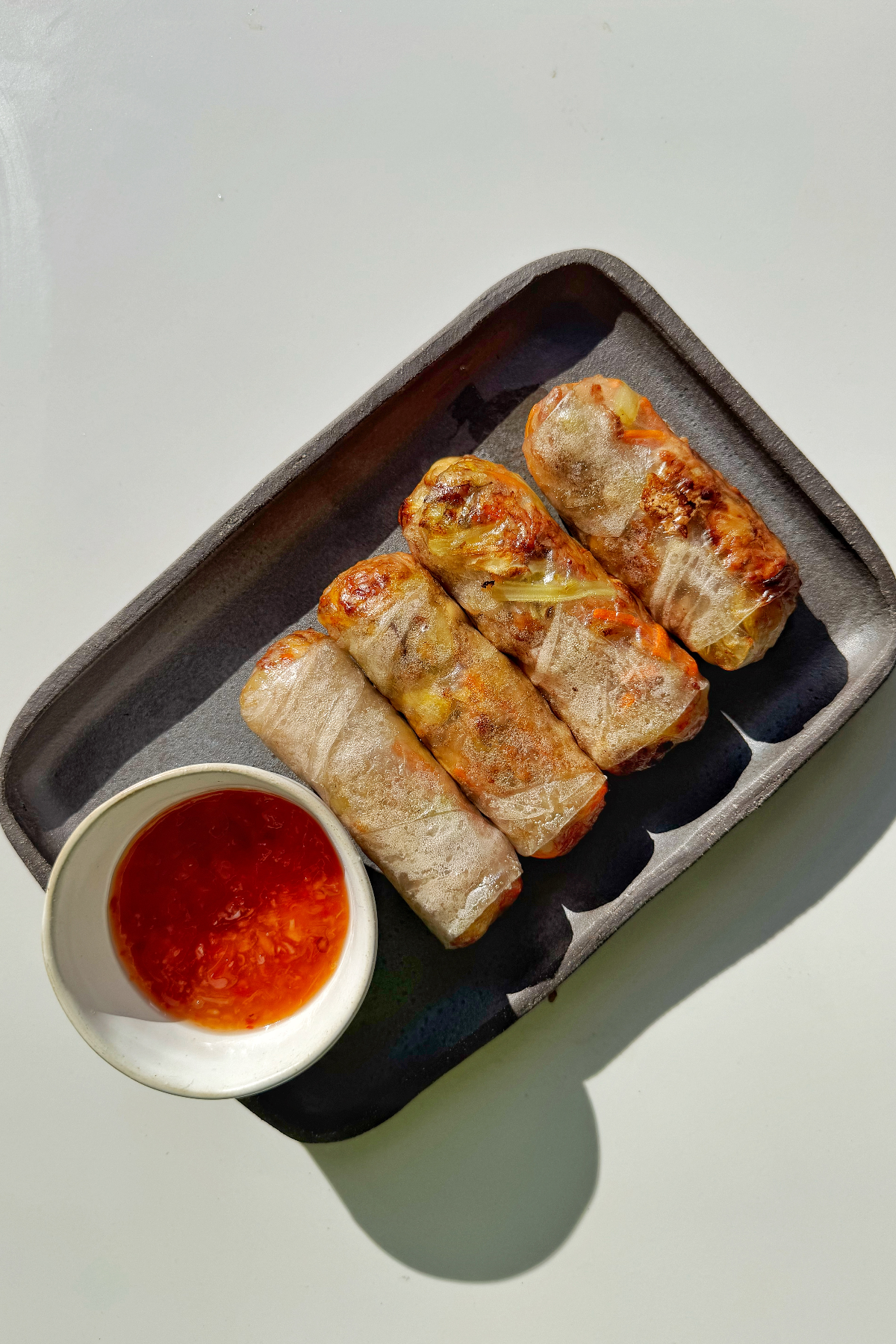 air fryer rice paper rolls with sweet chilli sauce.