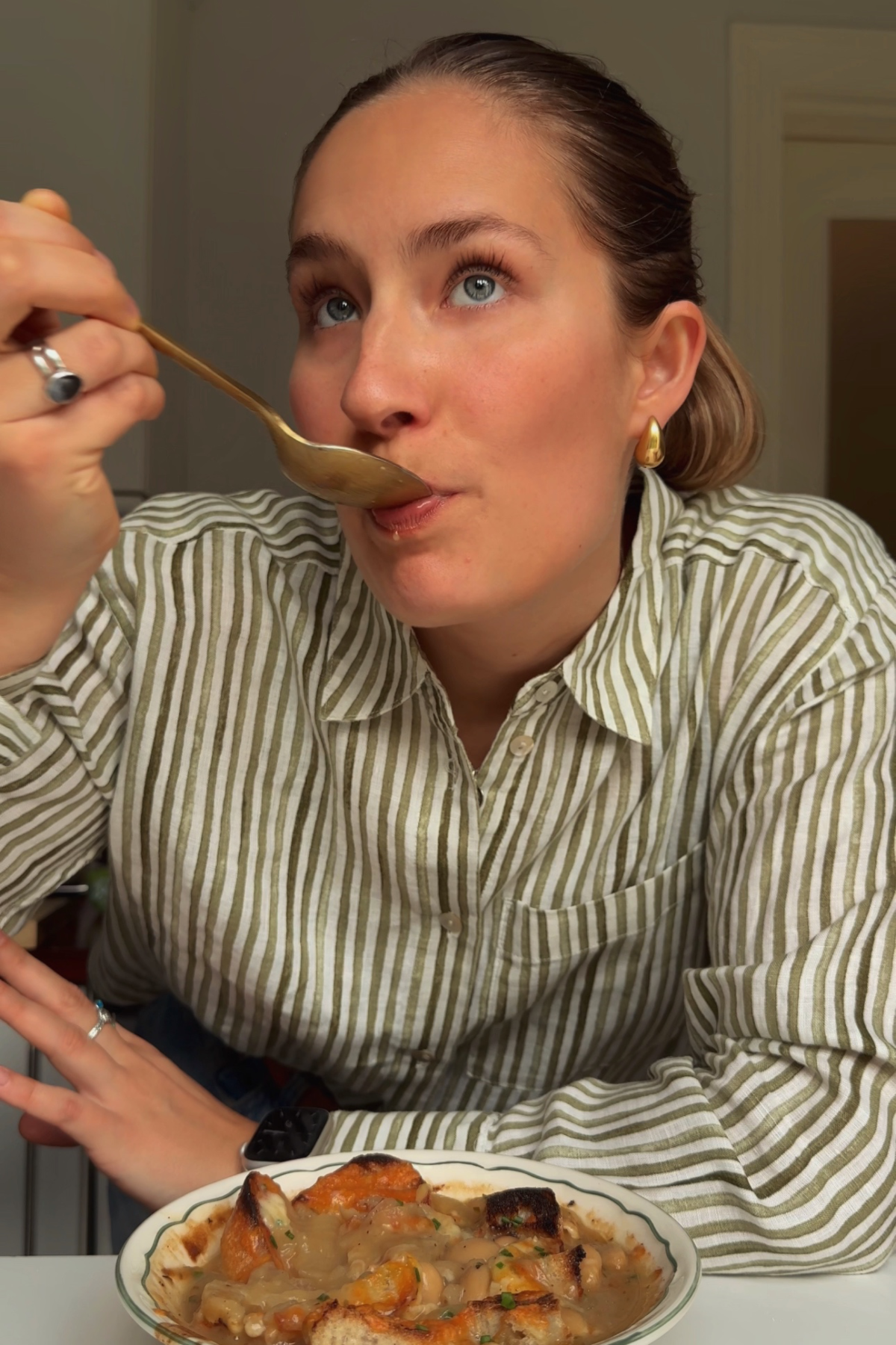 Emily eating butterbean soup.