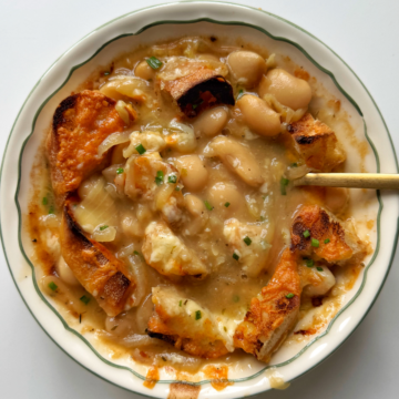 butter bean soup in white bowl.