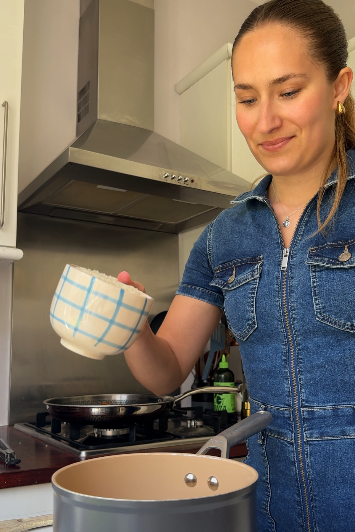 Adding rice into the pan.