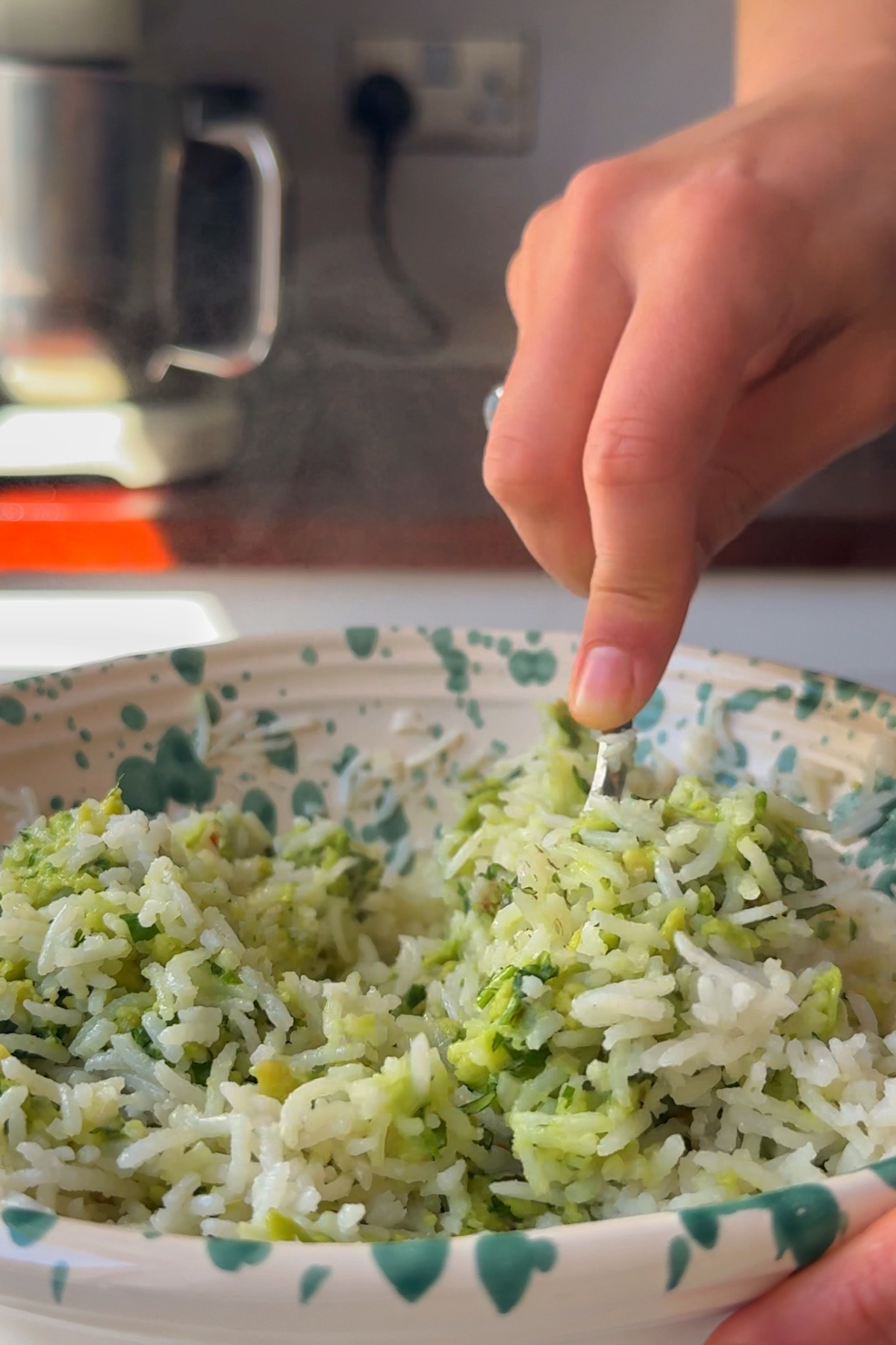Combining the coconut rice with avocado mixture.